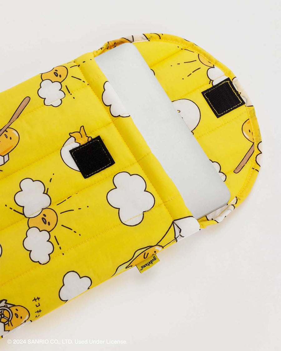 opened yellow gudetama 13 in puffy laptop sleeve with laptop inside