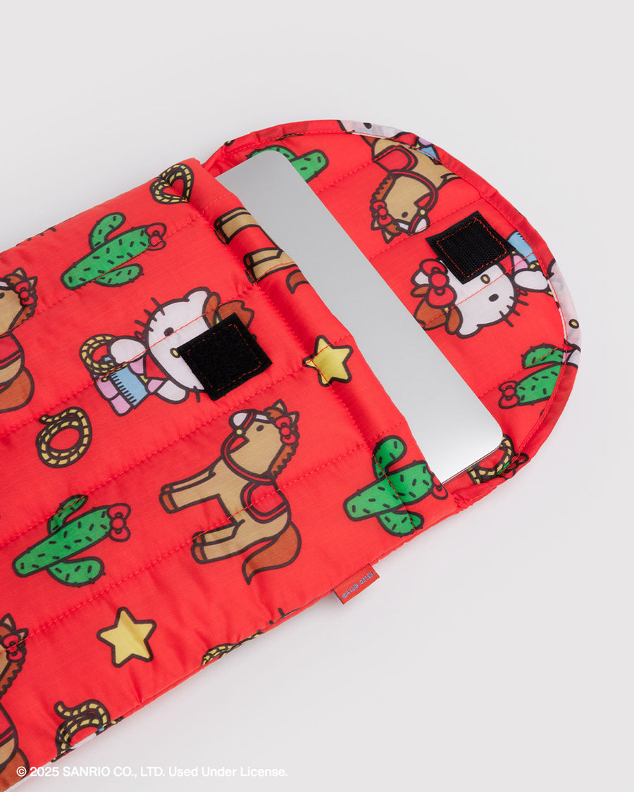 coral 13 in. puffy laptop sleeve with western hello kitty print with laptop inside