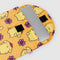 yellow 13 in. puffy laptop sleeve with  pompompurin and purple flower print with a laptop inside