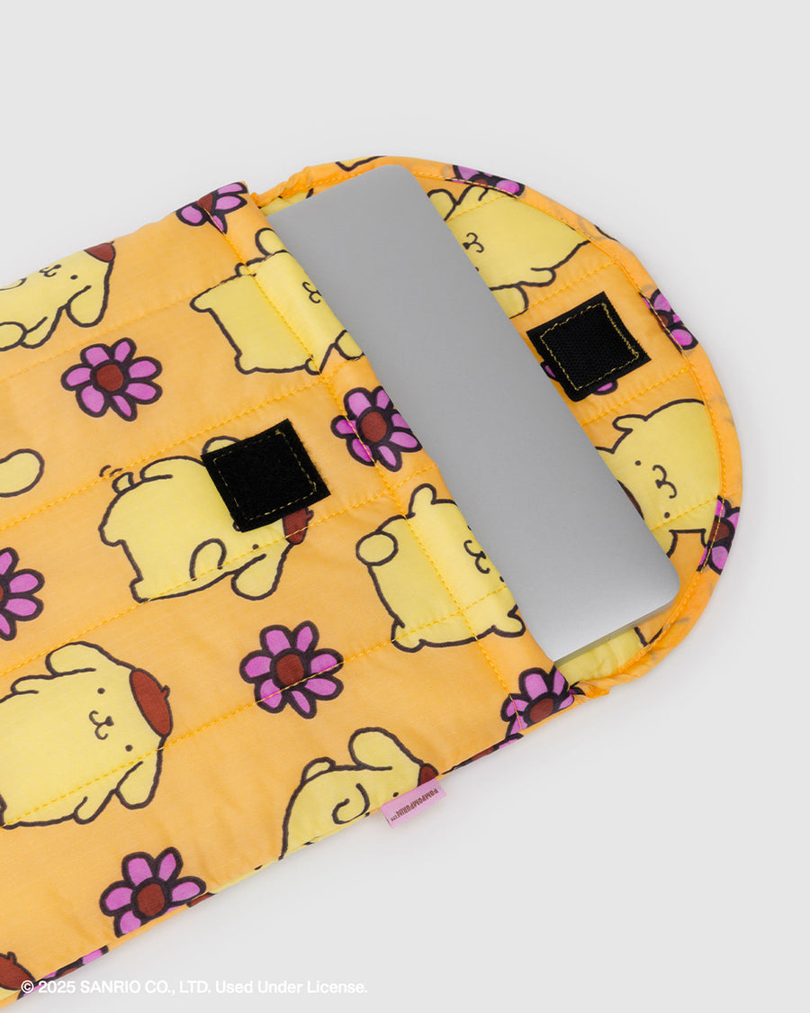 yellow 13 in. puffy laptop sleeve with  pompompurin and purple flower print with a laptop inside