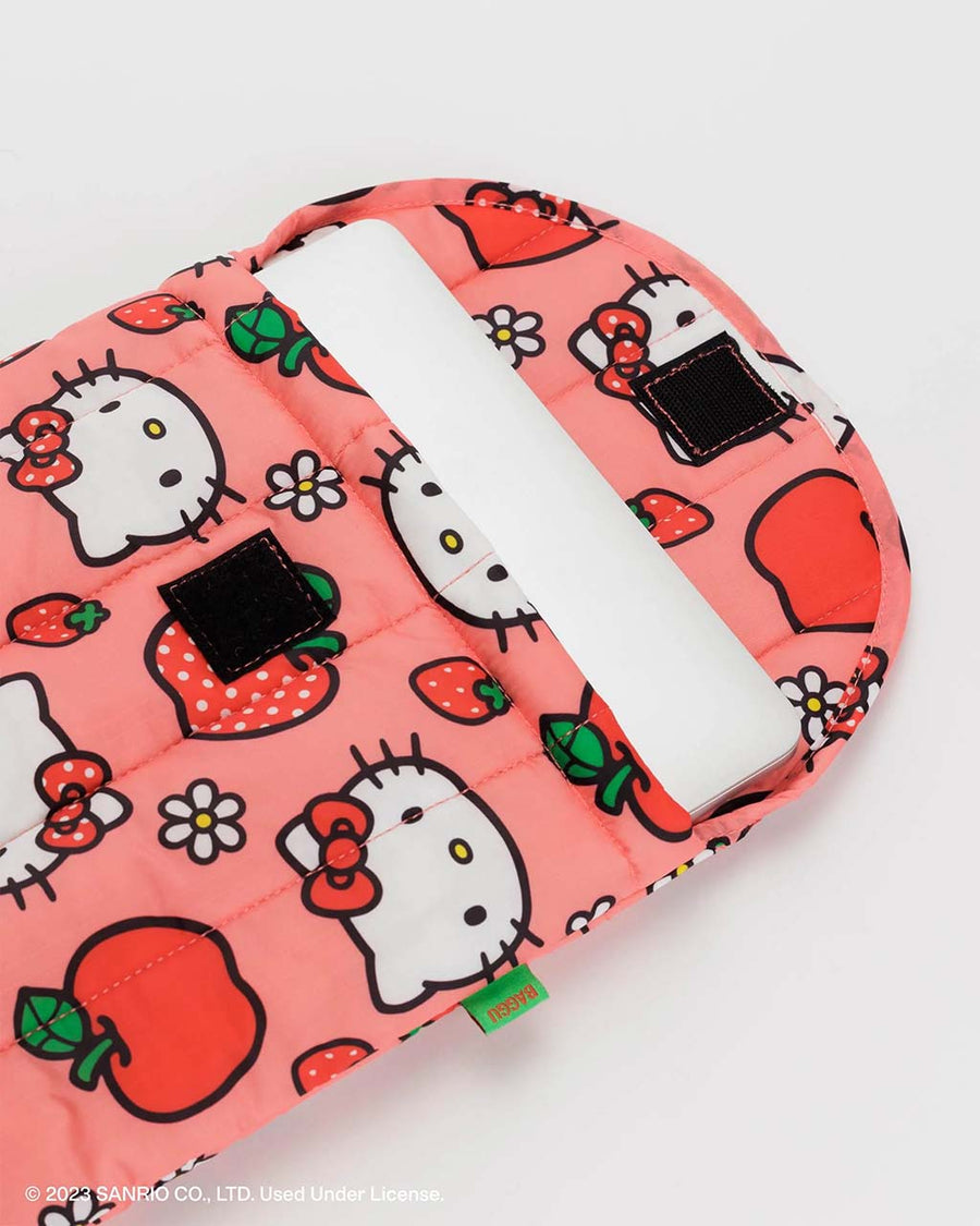laptop inside of pink 16 in. laptop sleeve with hello kitty face and apple print