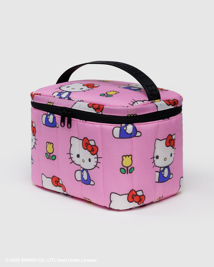 light pink puffy lunch bag with hello kitty and yellow tulip print and black trim and handle
