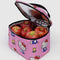 light pink puffy lunch bag with hello kitty and yellow tulip print and black trim and handle with apples inside