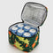 opened yellow puffy lunch box with orange tree print with cans inside