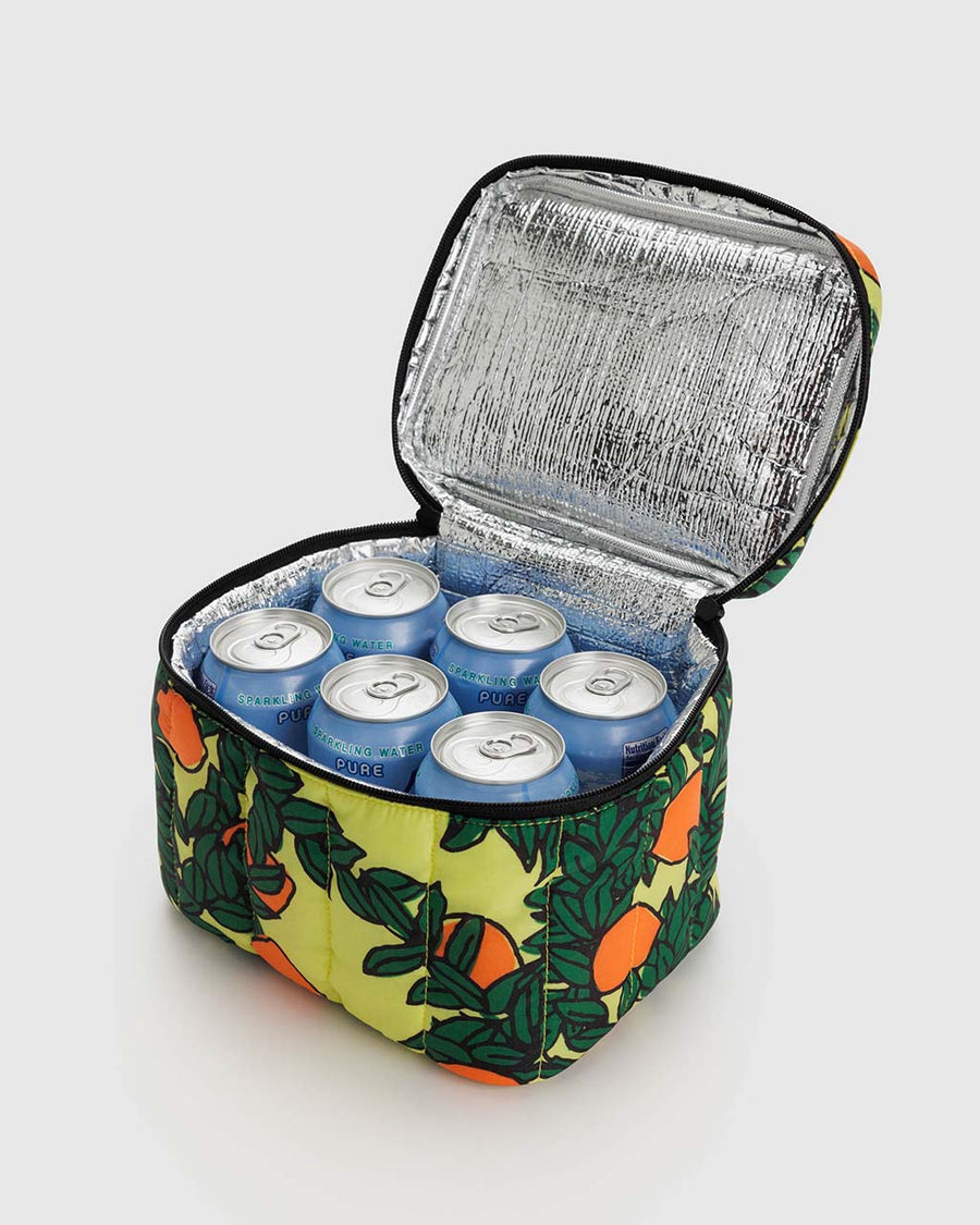 opened yellow puffy lunch box with orange tree print with cans inside