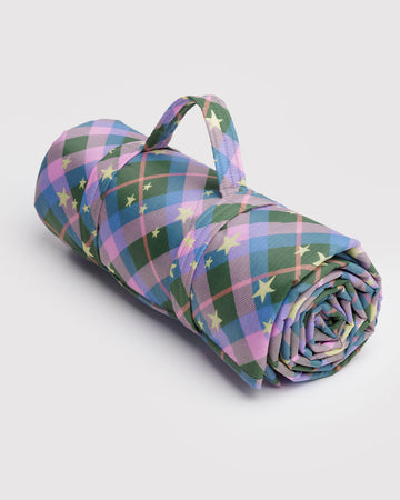 pink, green, and blue plaid puffy picnic blanket with pale yellow star print