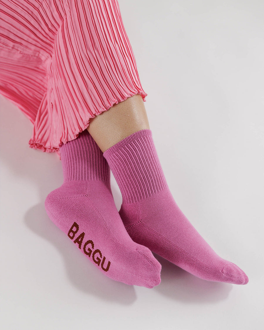 model wearing hot pink ribbed crew socks