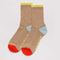 beige ribbed socks with yellow, blue and red accents