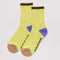light yellow ribbed socks with black, blue and beige accents