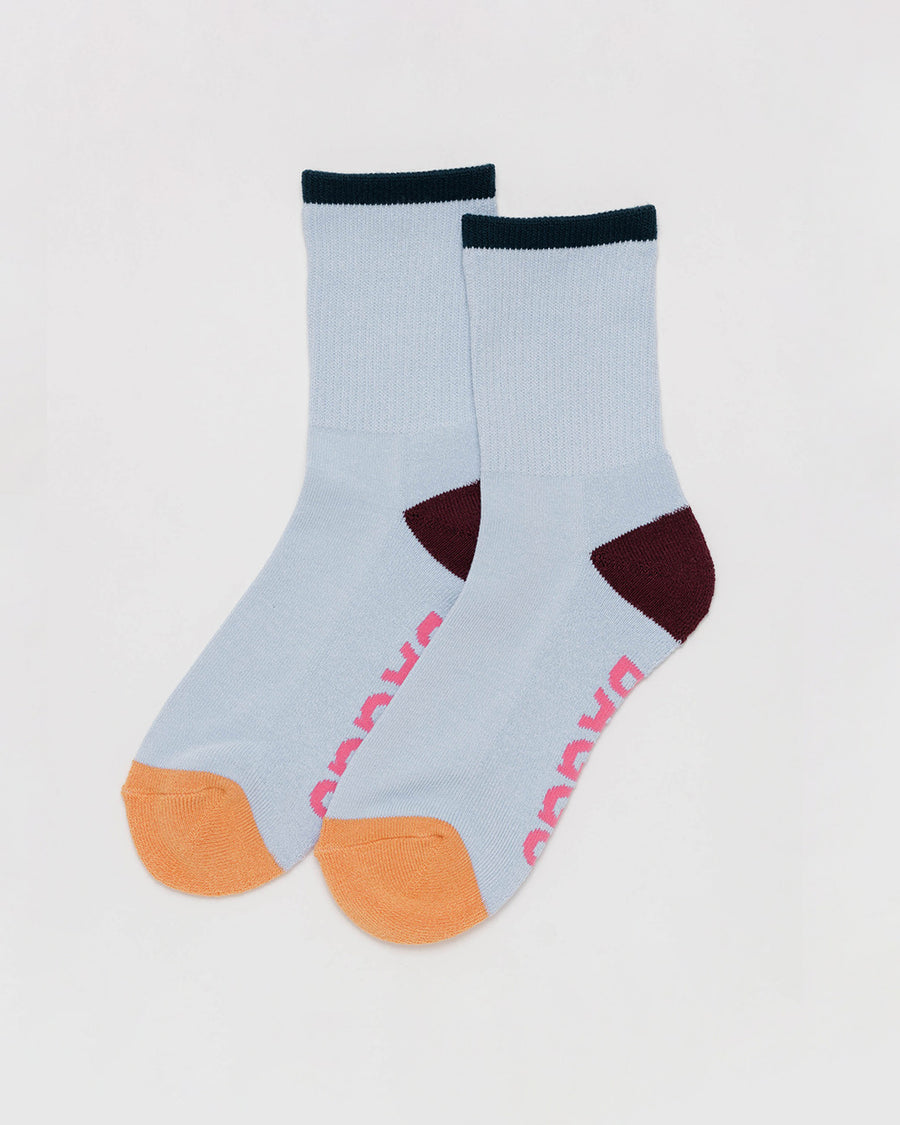 light blue ribbed crew socks with black, brown and coral accents