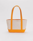 tan small boat tote with tangerine accents