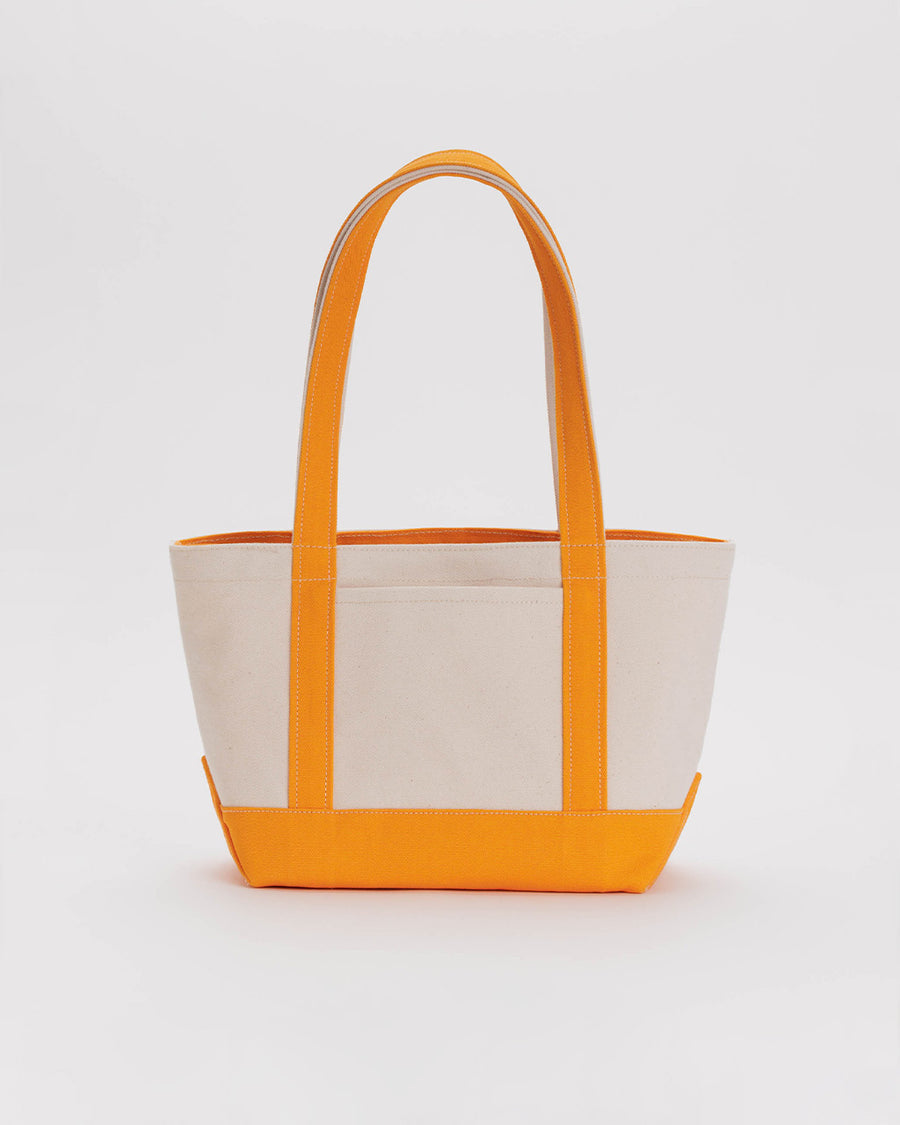 tan small boat tote with tangerine accents