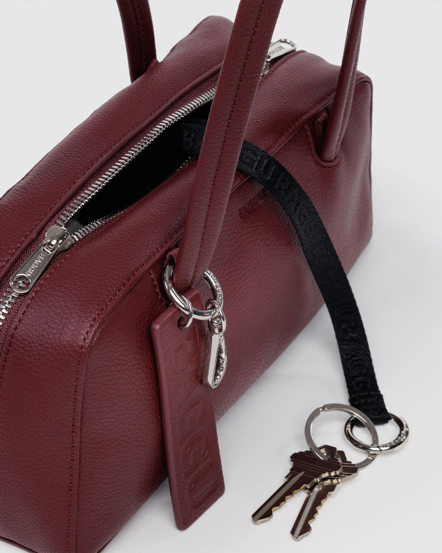 black key leash of mahogany small dome recycled leather bowler bag with silver charm clasp