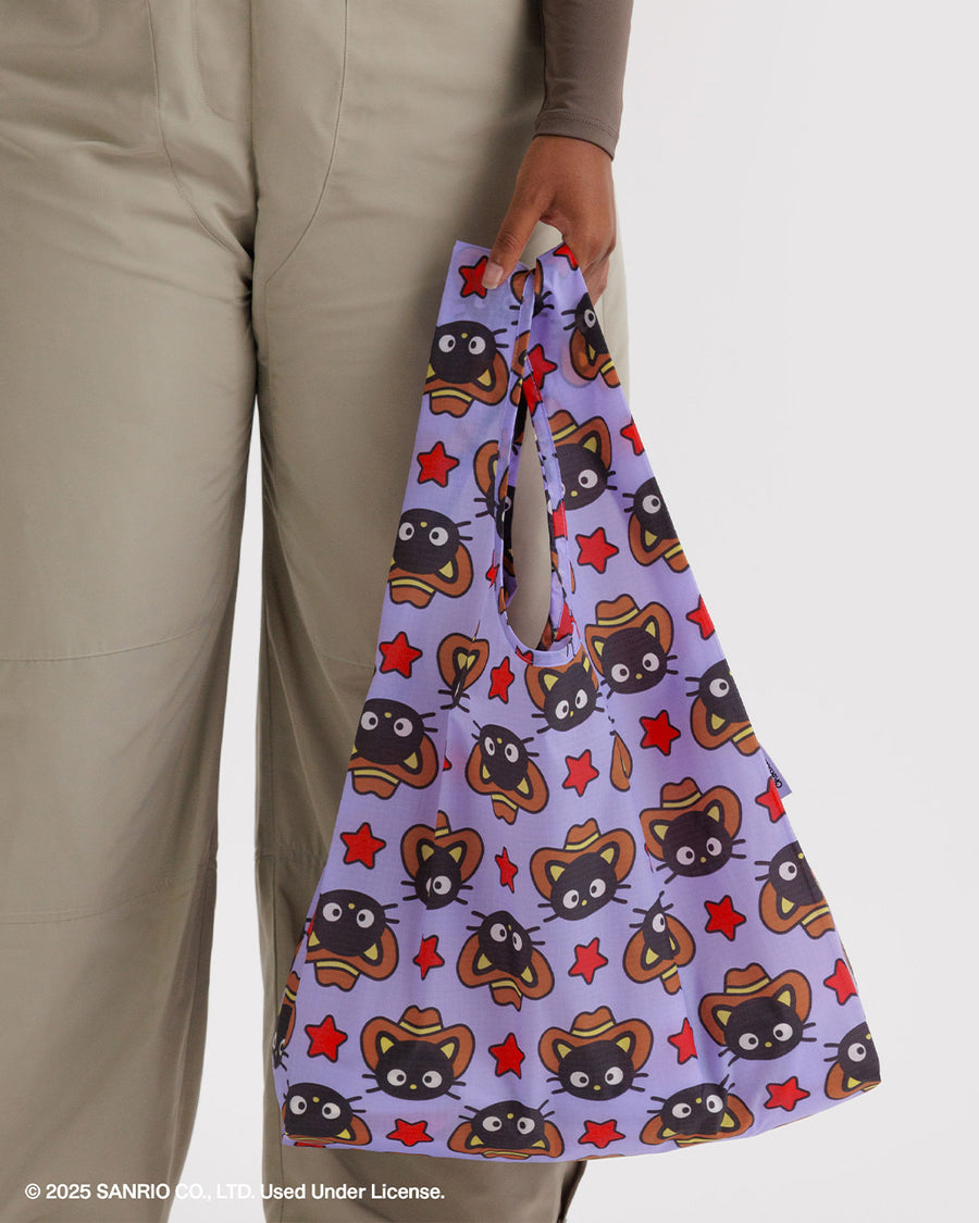 model holding purple standard baggu with all over western chococat print