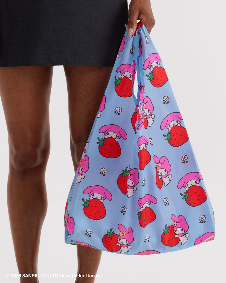 model holding light blue standard baggu with my melody and strawberry print