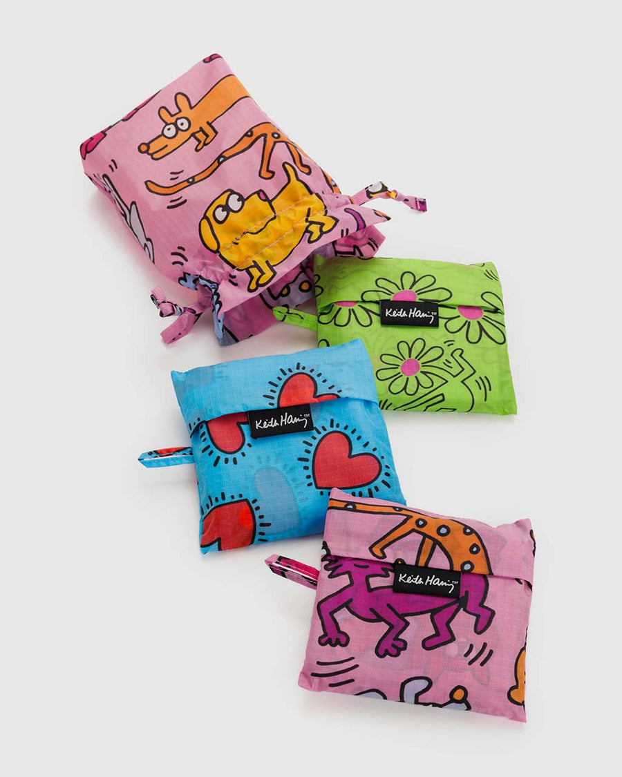 packaged set of three keith haring standard baggu bags: pink pets, green flowers and blue hearts