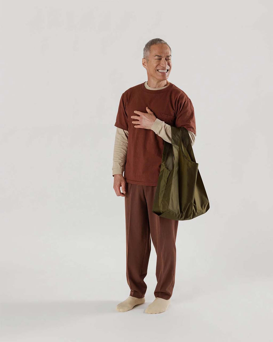 model holding rich brown standard baggu