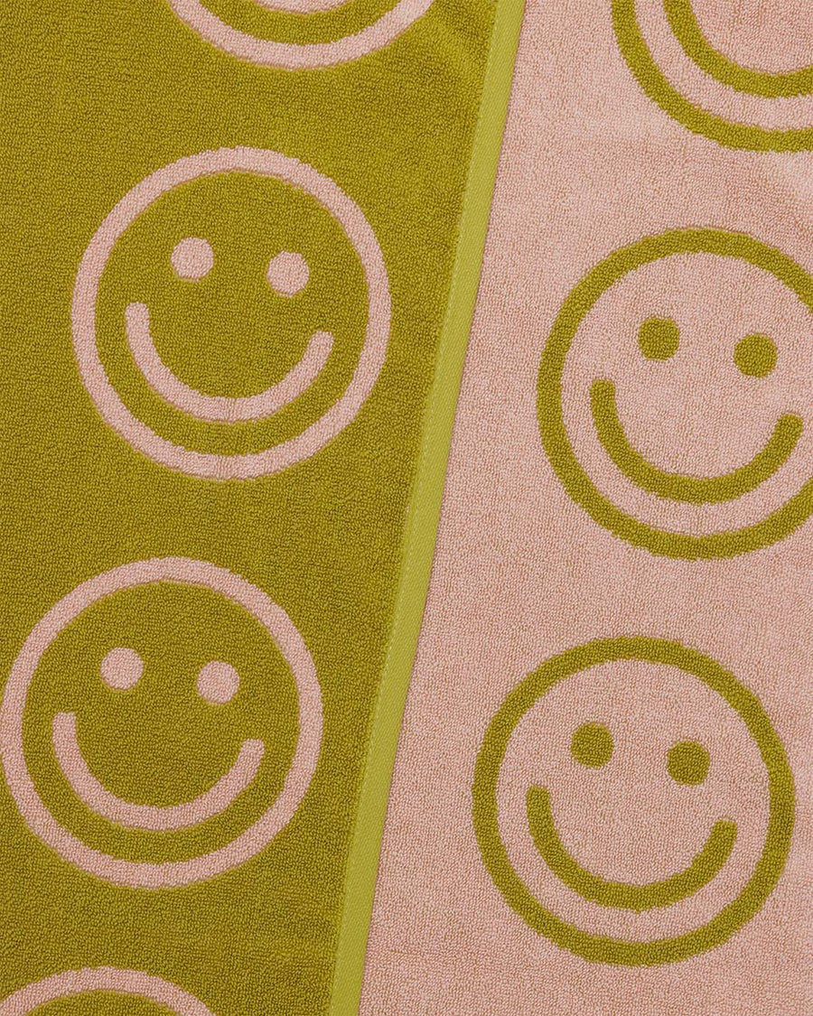 both sides of light pink and ochre smiley towel