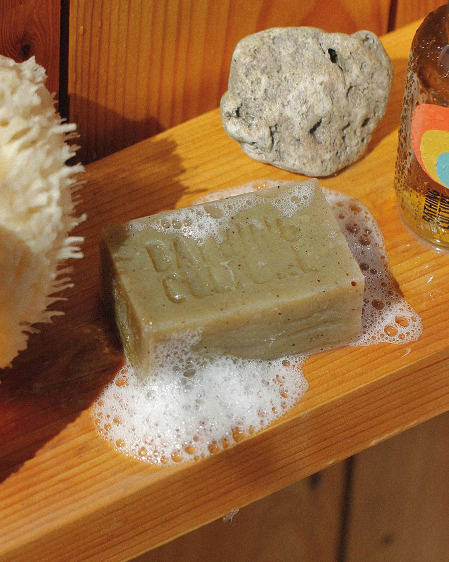 4.58 oz. mind and body bar in cathedral grove scent lathered on shelf