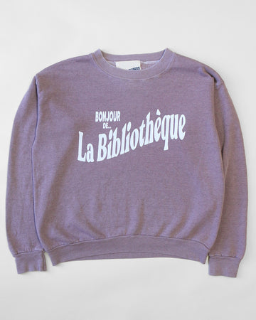 rosewood sweatshirt with white Bonjour De La Bibliothèque across the front