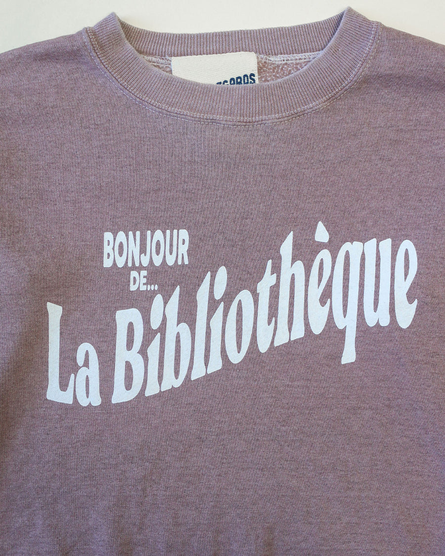 up close of rosewood sweatshirt with white Bonjour De La Bibliothèque across the front