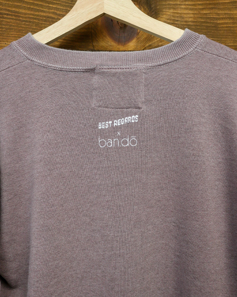 backview of rosewood sweatshirt with white Bonjour De La Bibliothèque across the front