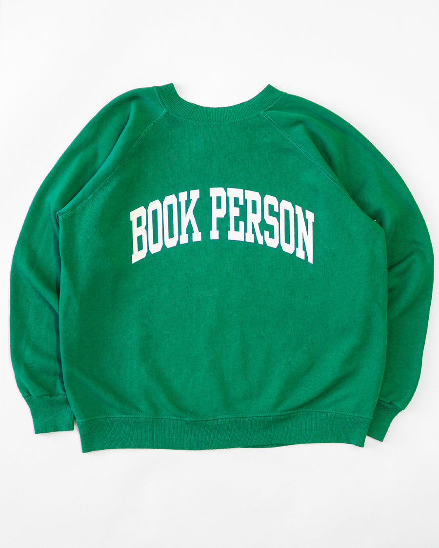 kelly green sweatshirt with white 'BOOK PERSON' across the front