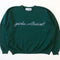 dark green sweatshirt with white chainstitch garden enthusiast across the front