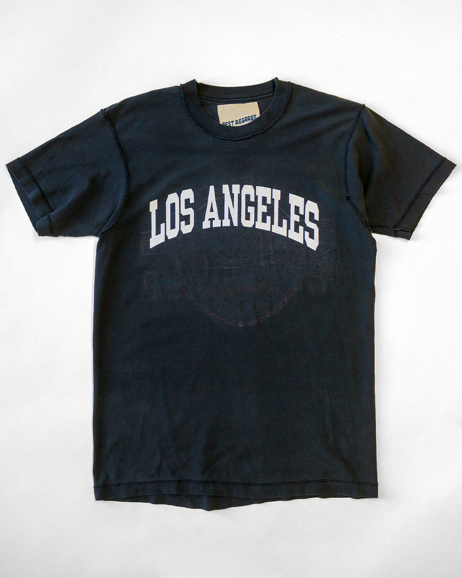 black upcycled tee with white LOS ANGELES across the front