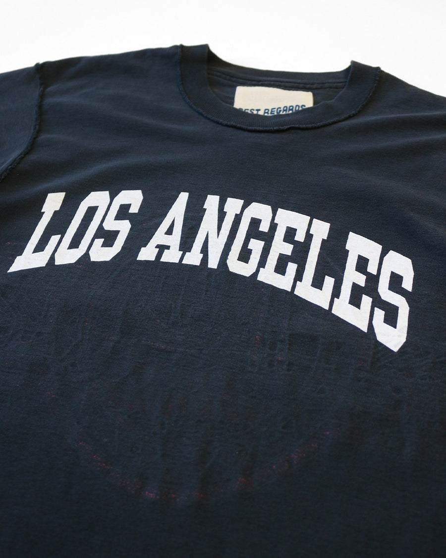 up close of black upcycled tee with white LOS ANGELES across the front