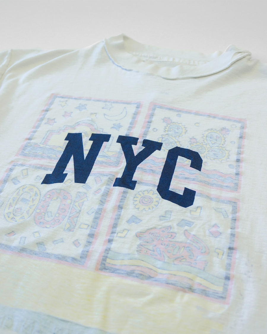 up close of white upcycled tee with navy NYC across the front