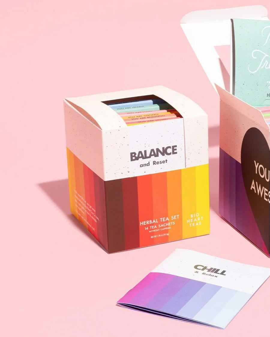 set of 14 'balance and reset' tea bags on a pink background