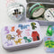 white tin with sketched colorful dogs and matching sticker flakes