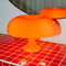 lit orange retro inspired mushroom lamp