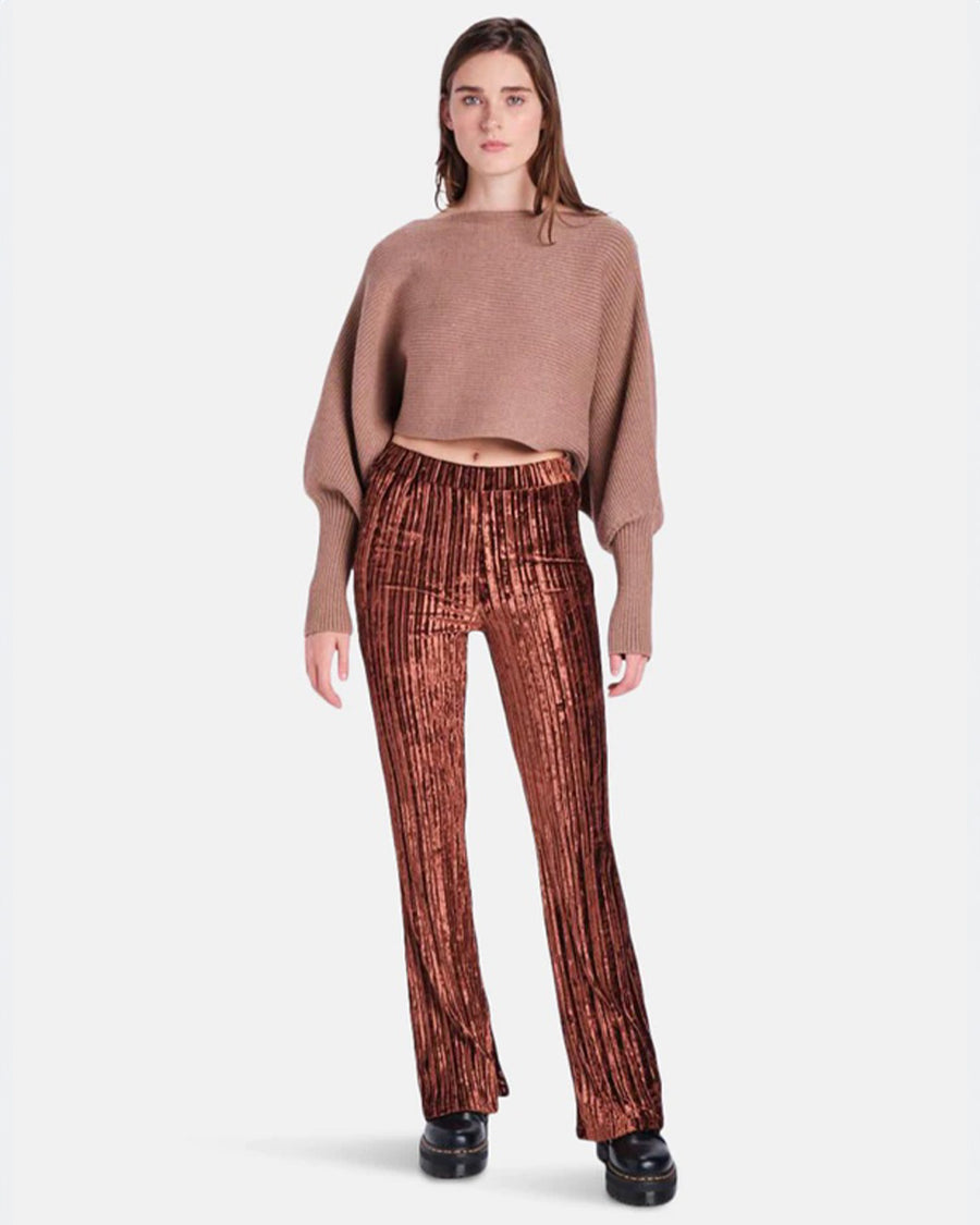 model wearing brown crushed velvet flared pants