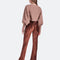backview of model wearing brown crushed velvet flared pants