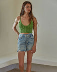 model wearing green crochet cropped tank
