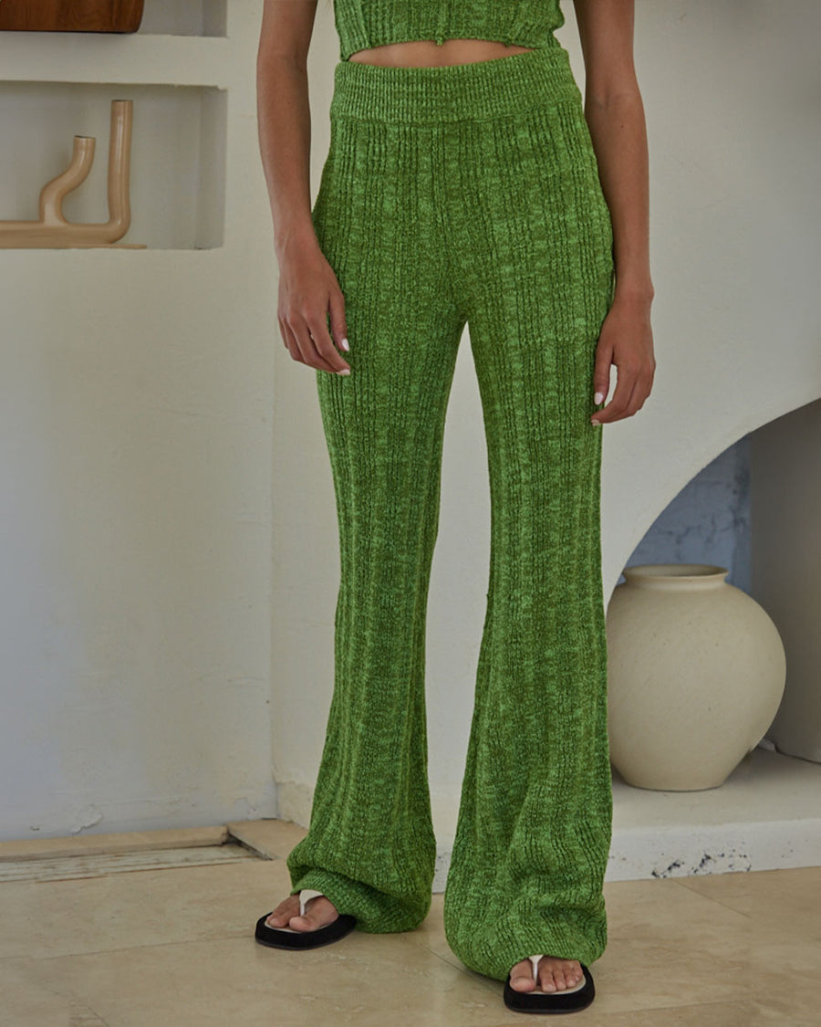 model wearing green crochet knit flared pants