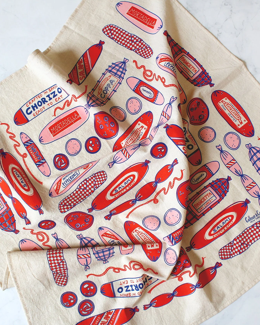 cream tea towel with red/pink pepperoni print
