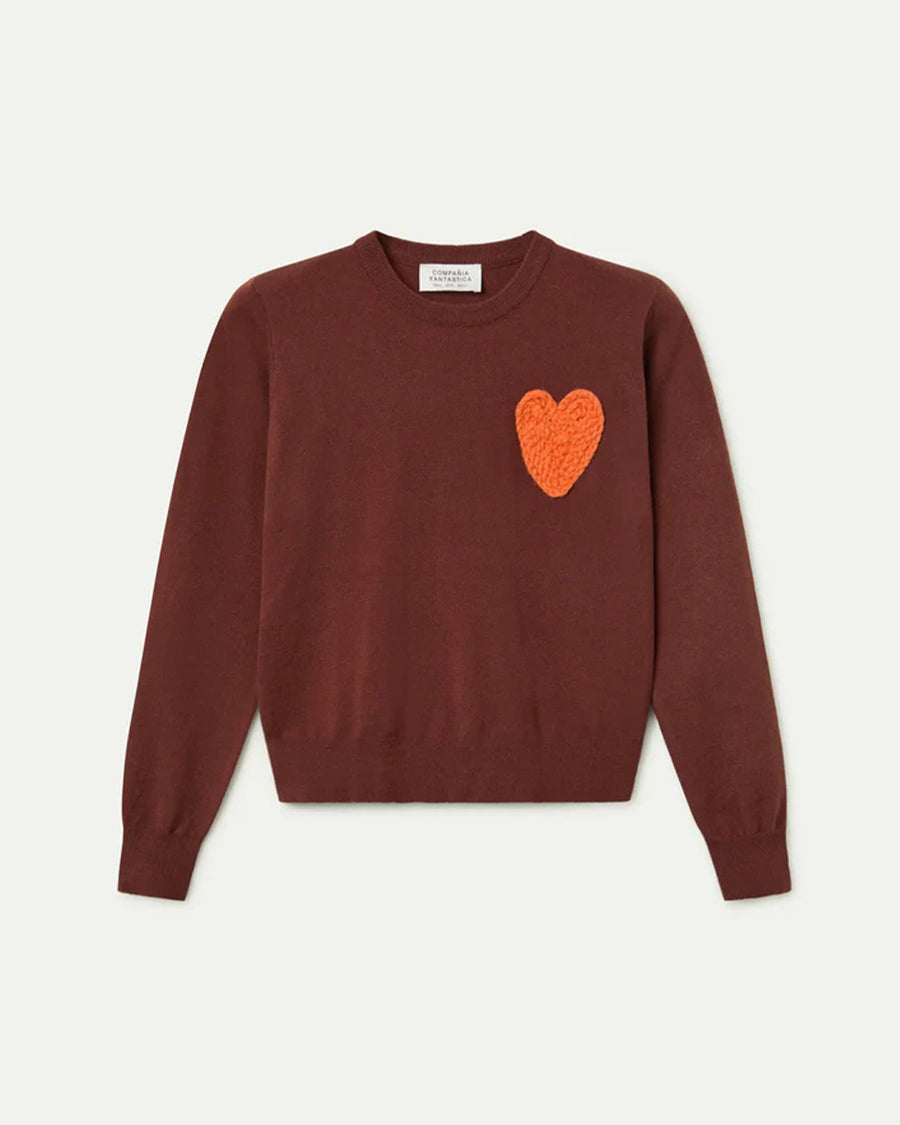 brown sweater with textured orange heart on the left bust