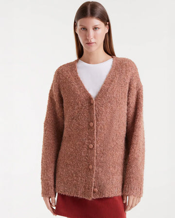 model wearing brown fuzzy textured oversized cardigan
