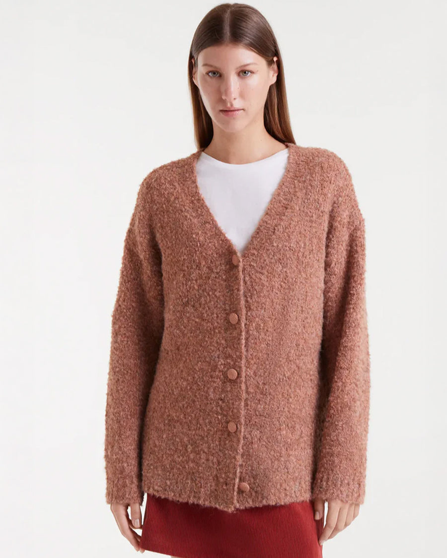 model wearing brown fuzzy textured oversized cardigan