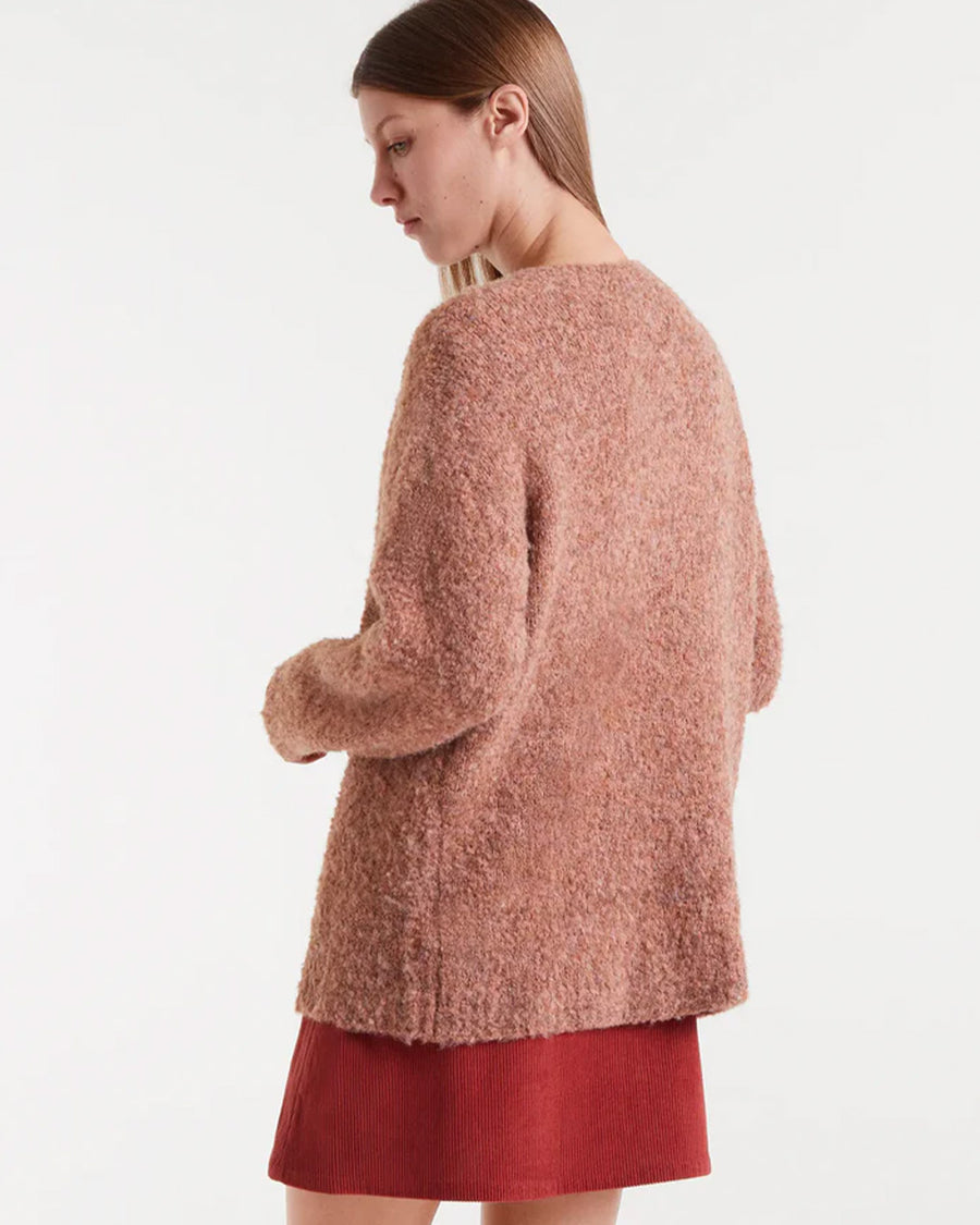 back view of model wearing brown fuzzy textured oversized cardigan