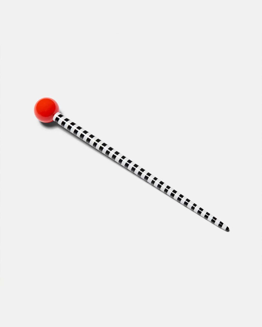 white and black stripe hair stick with red ball on the end