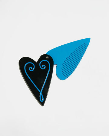 black heart compact with blue fine tooth comb