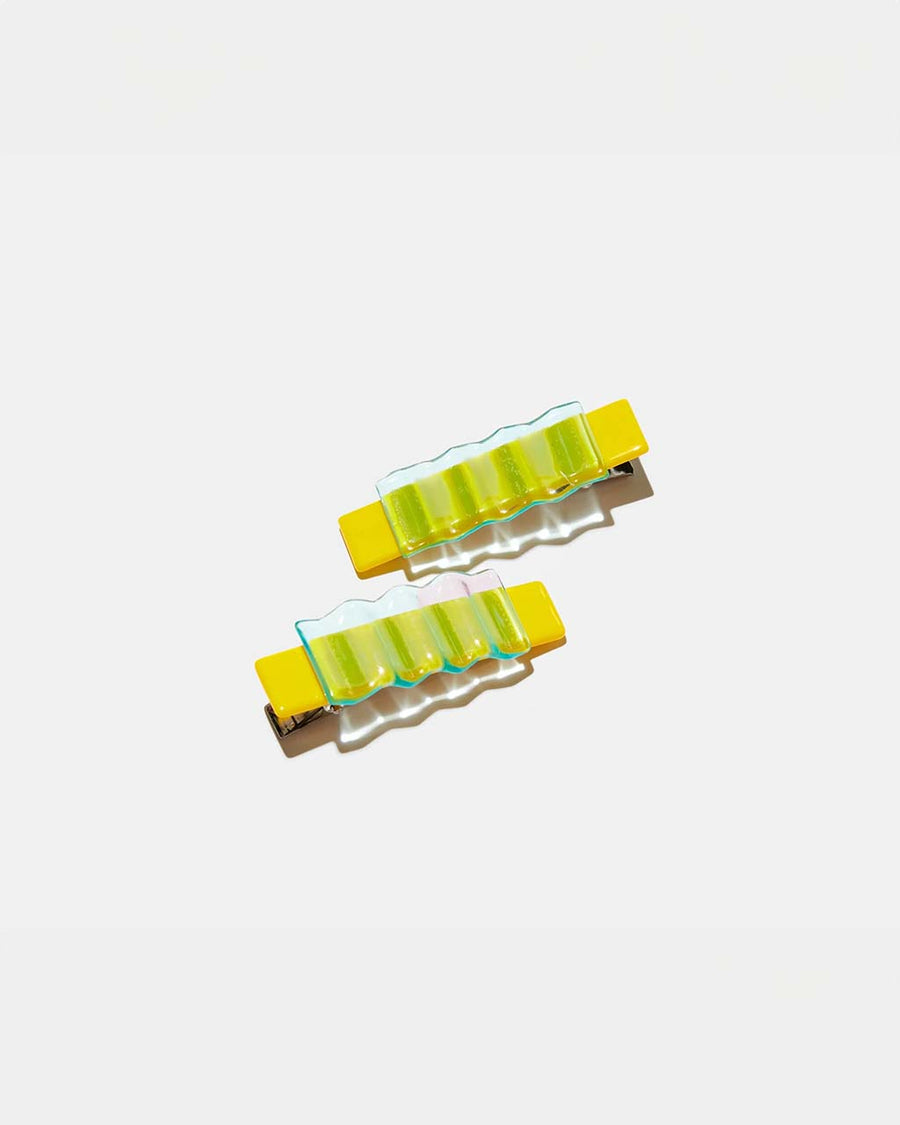 set of two yellow alligator hair clips with clear blue overlay