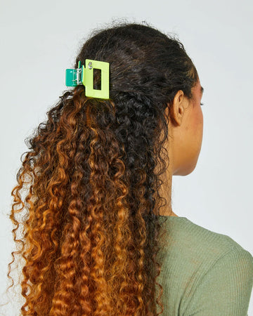 model wearing lime and teal midi box hair claw