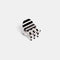 stripes side of double sided mini claw with white and black polka dots and black and white stripes
