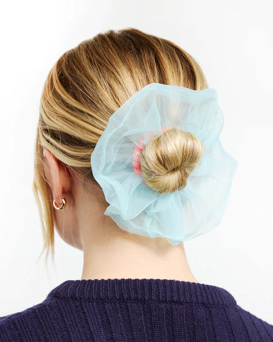 model wearing scrunchie with pink coil band and blue organza