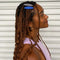 model wearing set of two hair clips: bright blue pointed action blurb and oval black and white stripes